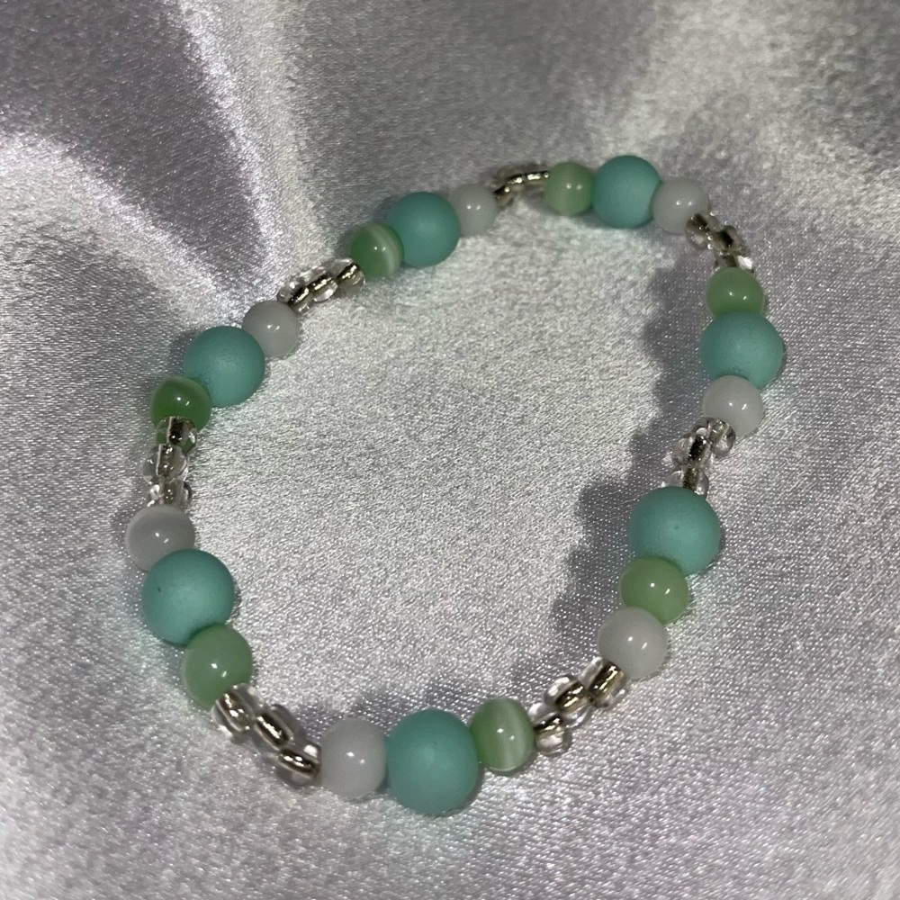 Aqua green , white and clear beaded stretchy bracelet. Handmade :)